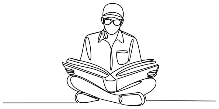 Man reading book sitting cross-legged