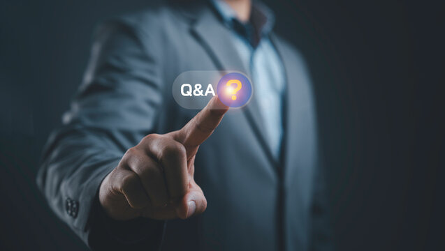 Business Q&A concept with businessman touching virtual question icon on digital interface, symbolizing customer support, communication, online assistance, FAQ service and problem solving.