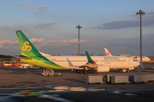 Narita, Chiba, Japan - May 26, 2026: A Spring Japan Boeing 737-800 (Registration JA01GR) parked on the airport ramp during sunset at Narita International Airport.