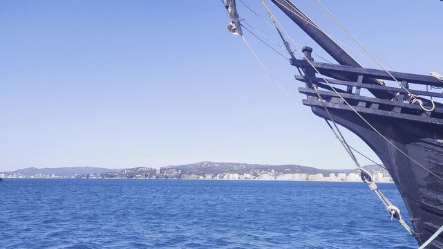 Historic ship at spanich harbor. Majestic sails and intricate woodwork stand out under the sun. A journey through maritime history. Experience the allure of the sea.