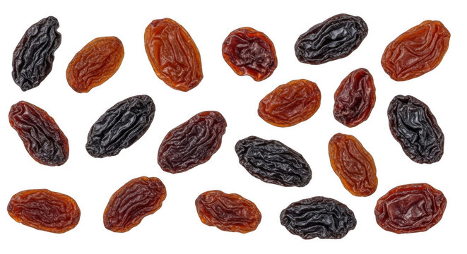 A collection of scattered dried raisins in shades of dark brown and reddish-brown, isolated on a solid black background