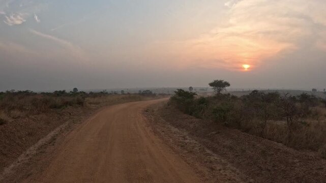 Cinematic sunrise safari in Murchison Falls National Park with golden morning light over African savanna, scenic wildlife travel video