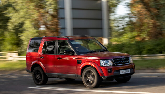 Milton Keynes,Bucks,UK - May 25th 2026: 2014 red Land Rover Discovery  car driving on a British road