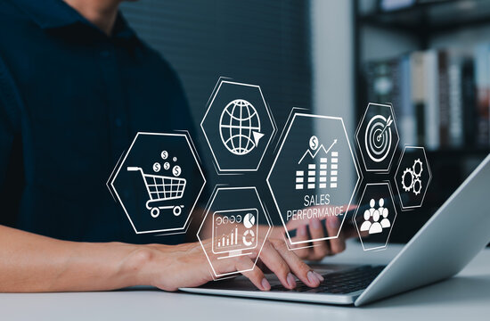 Sales performance and e-commerce analytics concept. person using laptop with shopping cart, growth chart, target, customer, website, revenue dashboard and automation icons. online sales strategy