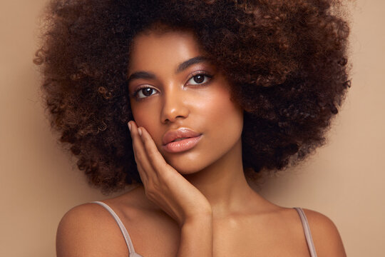 Beauty portrait of African American girl with afro hair. Beautiful black woman. Cosmetics, makeup and fashion