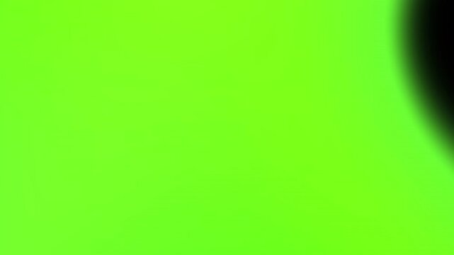 Electric neon green light leak overlay featuring smooth sweeping movement across dark background for modern cinematic transitions and elegant visual effects 4K UHD