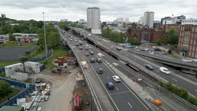 Aerial drone views of traffic on motorway viaducts/bridges, with lanes closed due to ongoing repairs, in Glasgow, Scotland, UK.