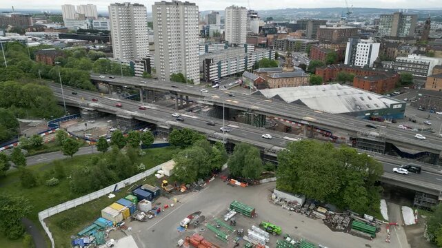 Various aerial drone views of traffic on motorway viaducts/bridges, with lanes closed due to ongoing repairs, in Glasgow, Scotland, UK.