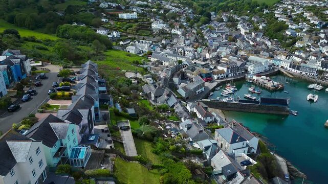Aerial views of the harbor in the costal village and port of Mevagissey on the south coast of Cornwall in the southwest of England.