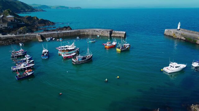 Aerial views of the harbor in the costal village and port of Mevagissey on the south coast of Cornwall in the southwest of England.