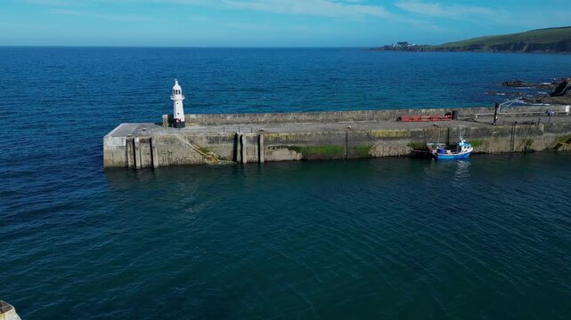 Aerial views of the harbor in the costal village and port of Mevagissey on the south coast of Cornwall in the southwest of England.