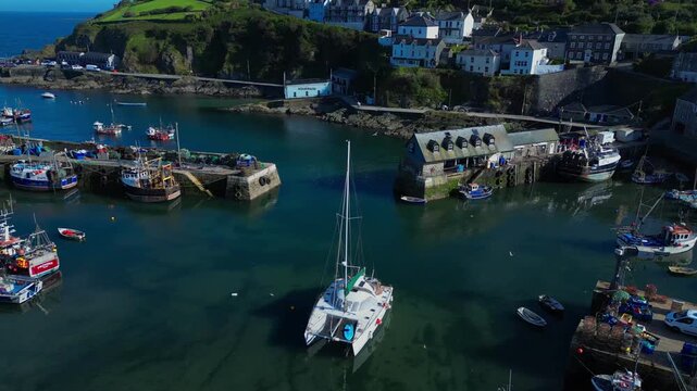 Aerial views of the harbor in the costal village and port of Mevagissey on the south coast of Cornwall in the southwest of England.