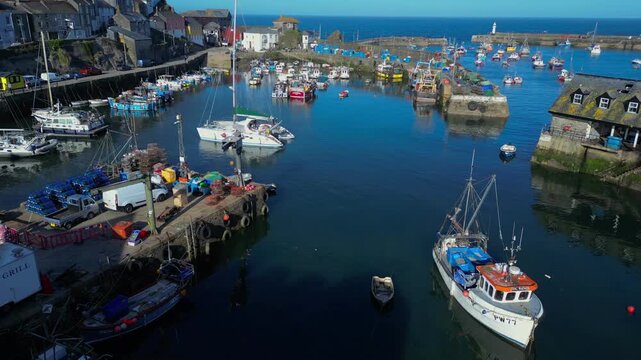Aerial views of the harbor in the costal village and port of Mevagissey on the south coast of Cornwall in the southwest of England.