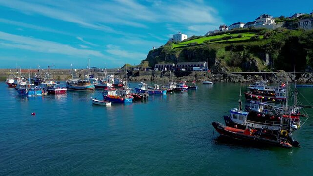Aerial views of the harbor in the costal village and port of Mevagissey on the south coast of Cornwall in the southwest of England.