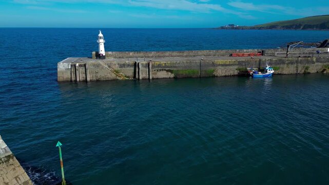 Aerial views of the harbor in the costal village and port of Mevagissey on the south coast of Cornwall in the southwest of England.