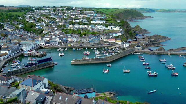 Aerial views of the harbor in the costal village and port of Mevagissey on the south coast of Cornwall in the southwest of England.
