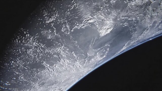 Panning camera revealing Earth crescent growing in orbit, showing clouds, blue limb and glare