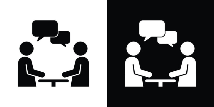 Business consultation icon showing two people talking over a table with speech bubbles. Great for teamwork, discussion, and meeting concepts.