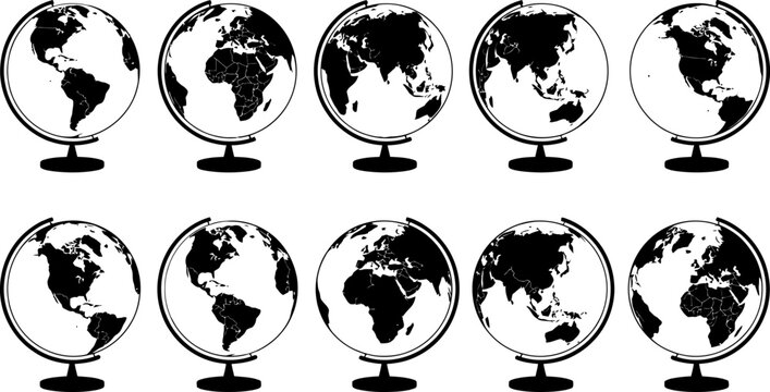 collection of black and white globes on stands showing different world maps