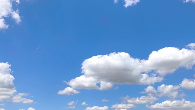 Big and pretty clouds moving in the blue sky