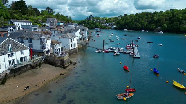 Aerial views of the seafront and estuary in the costal town of Fowey on the south coast of Cornwall in the southwest of England. 
