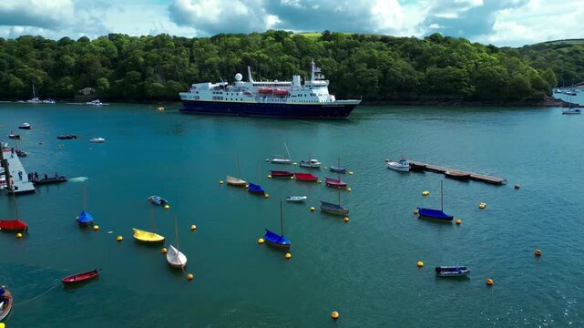 Aerial views of the seafront and estuary in the costal town of Fowey on the south coast of Cornwall in the southwest of England.