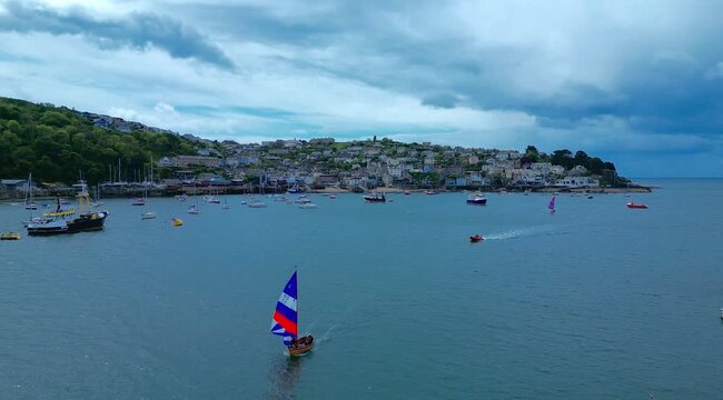 Aerial views of the seafront of the costal town of Polruan viewed from Fowey on the south coast of Cornwall in the southwest of England.