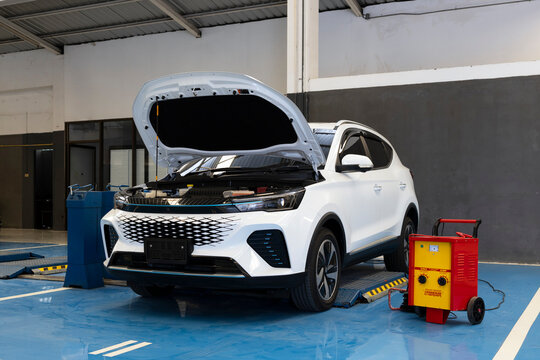 Damaged Car Under Repair in Professional Auto Service Garage