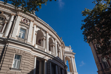 Obraz premium Elegant historic opera house building with arched windows and columns. Look up on Odesa city downtown architecture