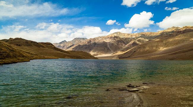Pristine Turquoise Mountain Lake Under Blue Sky with Scattered Clouds, Chandratal Lake,Himachal Pradesh, India