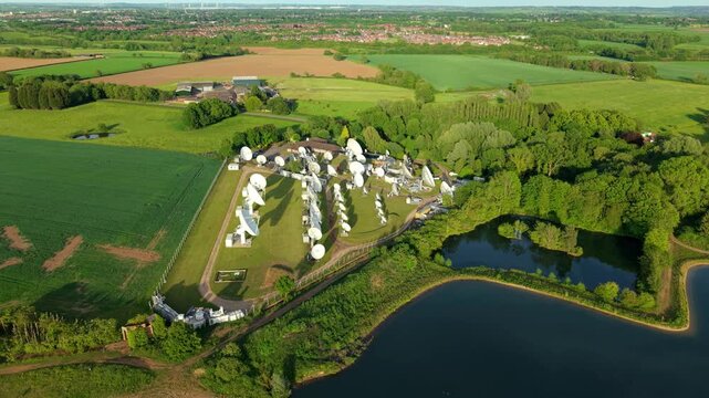 High angle view of telecommunications infrastructure displaying multiple satellite dish receivers in the Warwickshire countryside