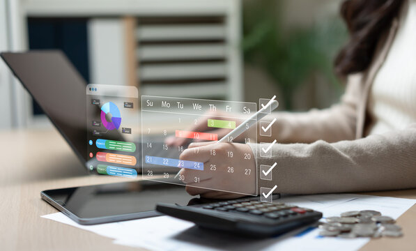Businesswoman using tablet for business project planning, workflow management, timeline organization, task tracking, and strategic chart analysis in modern office environment.