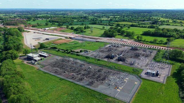 High angle aerial drone view of a massive high voltage electrical substation for bulk power distribution and grid resilience near Berkswell West Midlands UK