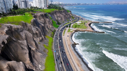 Obraz premium Green Coast Freeway In Miraflores In Lima Peru. Highrise Buildings. Green Coast Seascape. Travel Destination. Green Coast Freeway In Miraflores In Lima Peru. Leisure Park Landscape. Miraflores Skyline