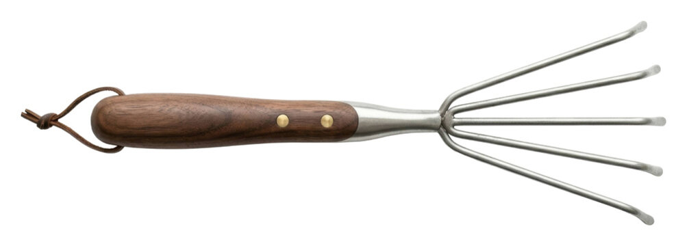 Gardening action with hand rake tool in outdoor garden environment close-up view isolated on transparent background