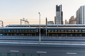 High-Speed Train at Hangzhou Station with City Skyline © NguyenNgoc