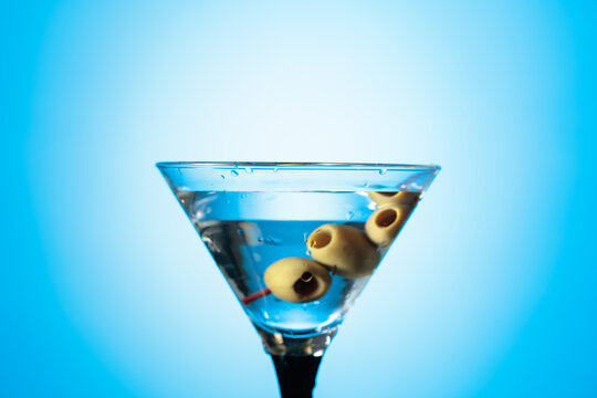 A green olives in martini glass.