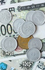 Japanese yen money bills and coins on table. Japan cash of JPY currency close up © Larysa