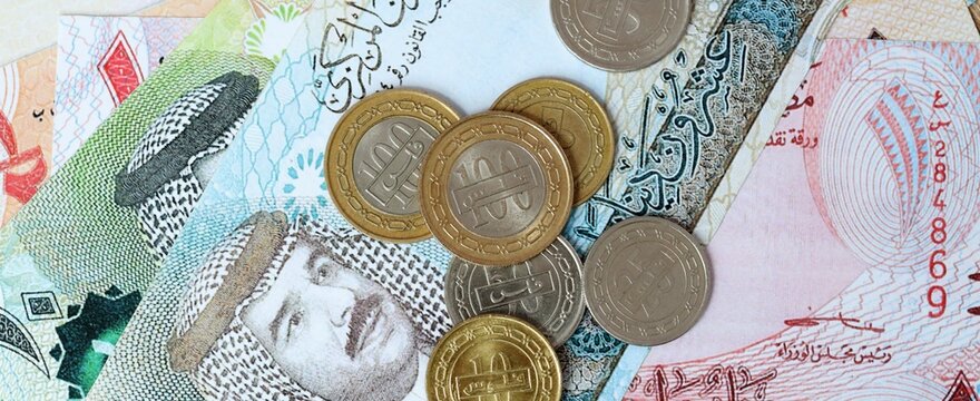 Bahraini dinar money bills and coins on table. Bahrain cash of BHD currency close up