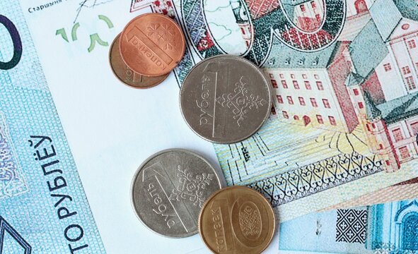 Belarusian ruble money bills and coins on table. Belarus cash of BYN currency close up