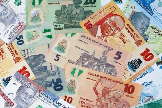 Nigerian naira money banknotes bunch on table. Nigeria bills of NGN currency close up