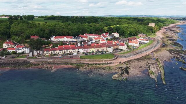 Aerial view of the coastal town of West Wemyss in Fife. A beautiful seaside panorama of the traditional Scottish village and its rocky shoreline along the Firth of Forth.