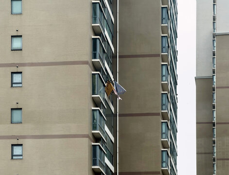 Urban high-rise apartment balconies with hanging laundry in Xuhui District Shanghai, China