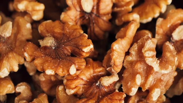 Shelled walnuts close-up, healthy snack rich in vitamins, omega-3 and nutrients. High quality 4k footage