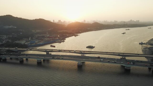 A stunning aerial view of the Vasai Creek Bridge in Mumbai, India, captures the seamless connection between the city and its northern suburbs. Surrounded by vast water bodies and coastal landscapes.