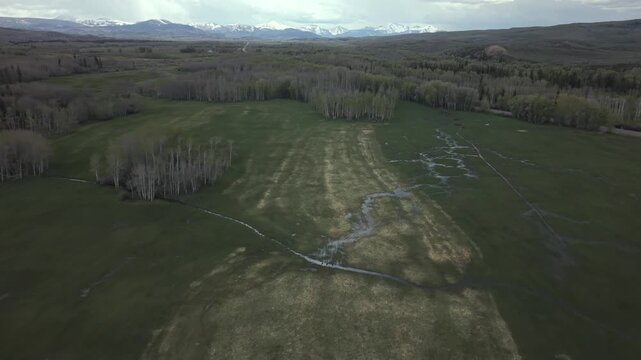 Wyoming Farmland with Uinta Mountains Aerial Landscape 4K