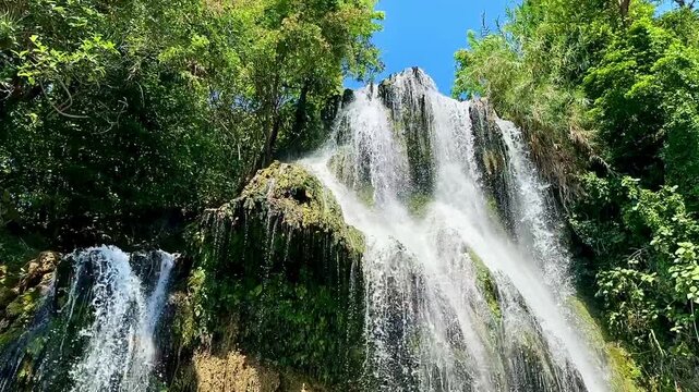 Sunlit Waterfall Cascades Beneath Blue Sky (Tamasopo, San Luis Potosi, Mexico)