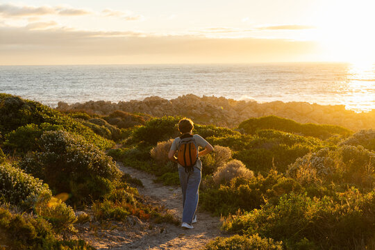 child, boy young boy, active, exercise, exploring, sunset, coastline, dekelders, South Africa, western cape, nature, walking, people, path, landscape, waves, water, ocean, sea,  travel, summer, person