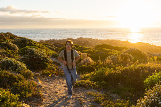 child, boy young boy, active, exercise, exploring, sunset, coastline, dekelders, South Africa, western cape, nature, walking, people, path, landscape, waves, water, ocean, sea,  travel, summer, person