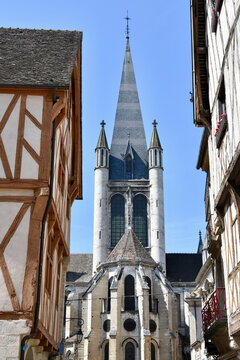 Apse and Steeple of Notre-Dame of Dijon, France with Half-Timbered Buildings on Left and Right - Portrait